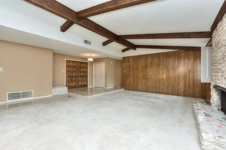 Wide open living space with wood burning fireplace