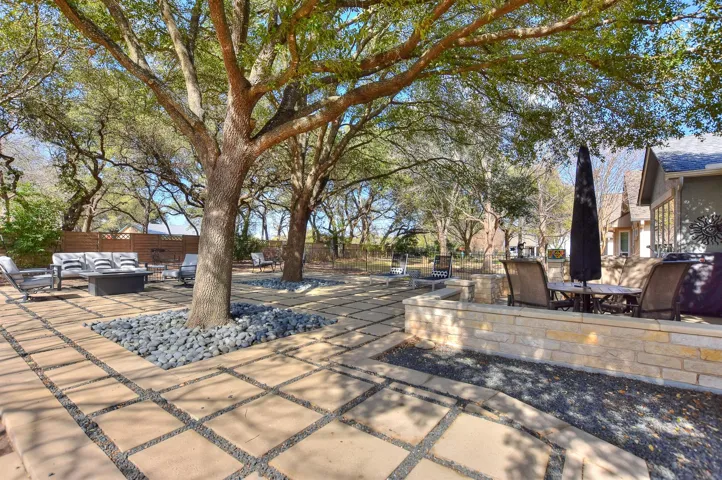 Spacious back yard with designer treatment.  Not much grass to mow!