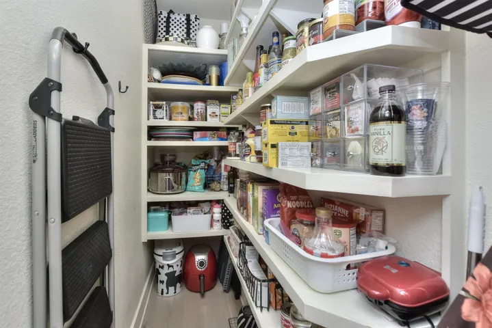 This amazing PANTRY is just outside the kitchen closest to the ovens & stove top. ...