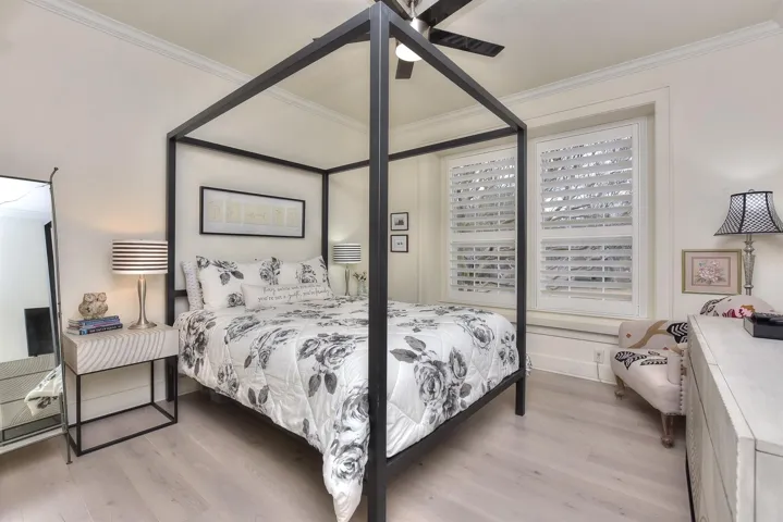 This room makes one feel like a princess.  Plantation Shutters were added, flooring replaced....