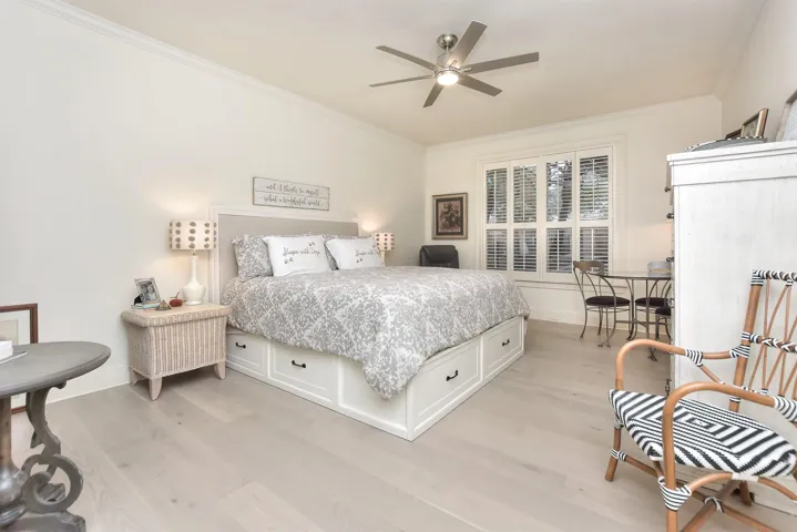 Pure and simple....the perfect place to retreat to.  Floors replaced, ceiling fan & light replaced, Plantation Shutters!   Room for a seating area... Read your book.  Relax.