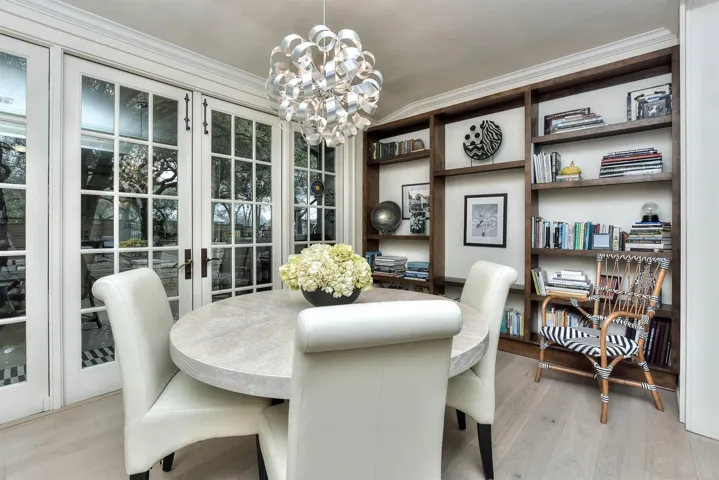 I also LOVE this dining room.  French paned glass doors lead to the back yard which has also been totally re-done by the Sellers.  This book case is built in.  Light fixture was also replaced....and just makes the room!