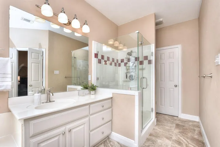 Recently updated primary bath; frame less shower