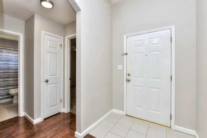 There are 2 bedrooms and a full bath at the front of the home when you enter. Great in-law plan!