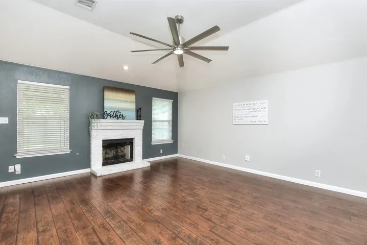 Family room with fireplace and raised hearth.