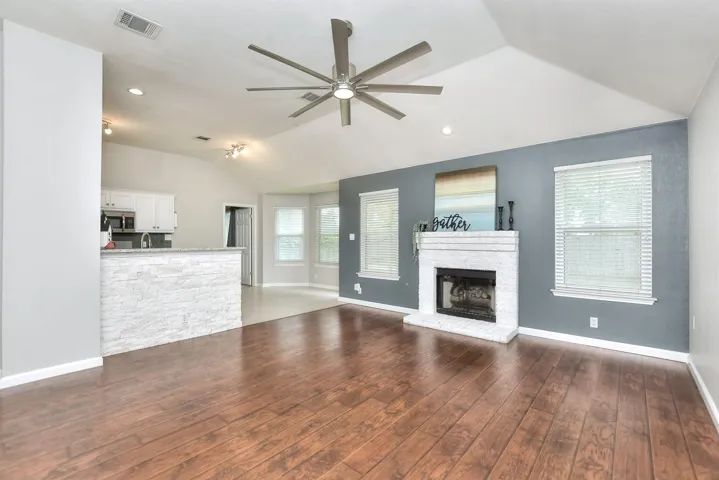 The family room and kitchen combine for a wall of windows allowing for abundant natural light.