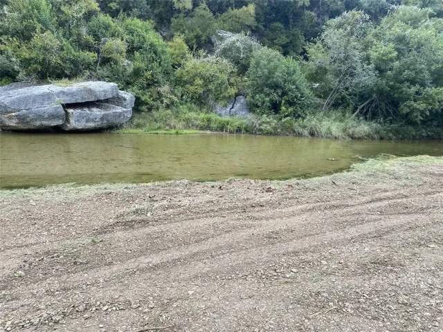 View of water feature with a view of trees