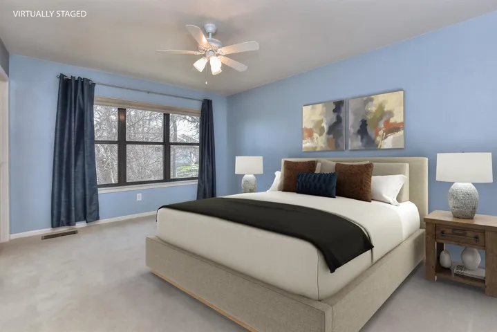 Bedroom featuring visible vents, carpet flooring, baseboards, and ceiling fan