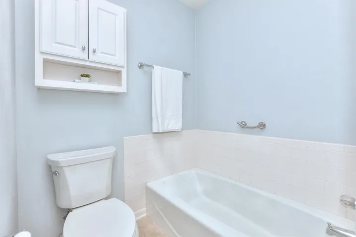 Bathroom with a garden tub and toilet