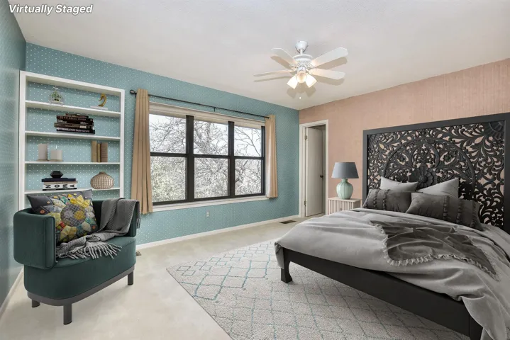 Bedroom with visible vents, carpet flooring, wallpapered walls, baseboards, and ceiling fan