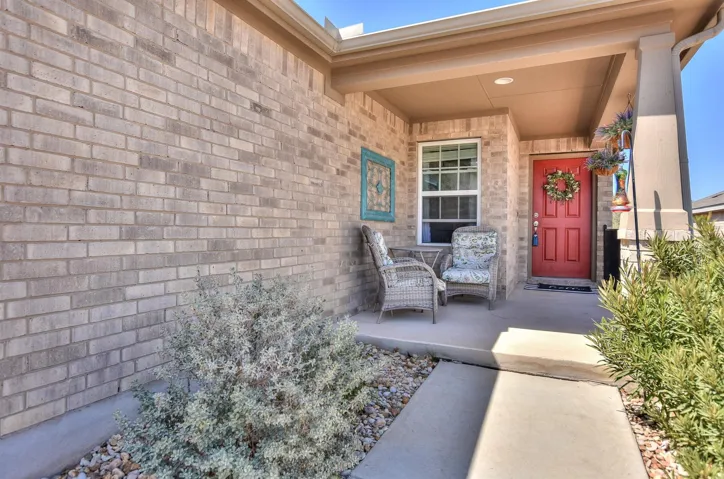 View of exterior entry featuring a porch