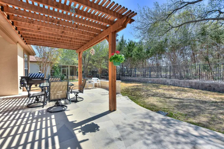 View of patio / terrace featuring a pergola, outdoor dining space, and fence