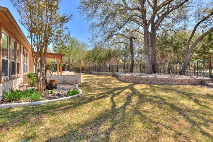 View of yard with a fenced backyard and a patio area