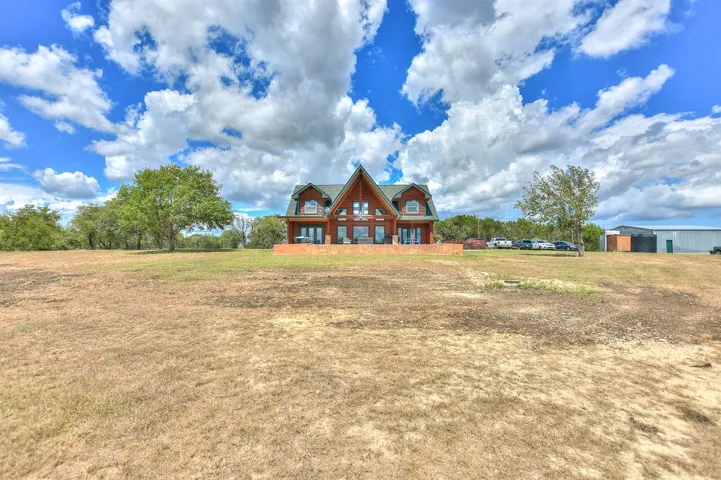 View of front of property with a front lawn