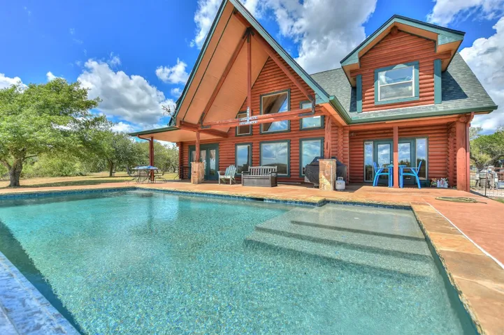 Outdoor pool featuring a patio area