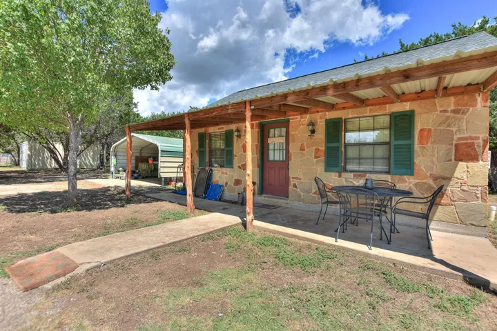 View of patio featuring a carport