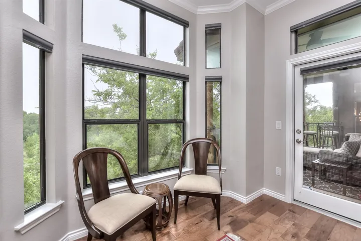 Primary bedroom with large windows and a great view