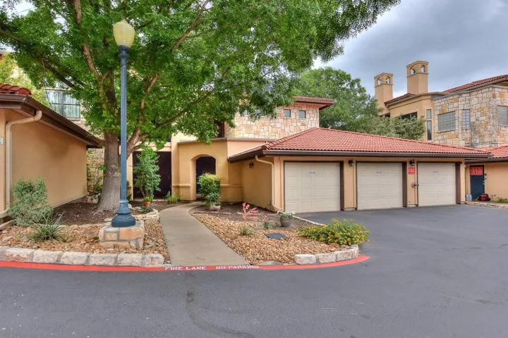 This condo comes with 2 garages and 2 additional space to park in front