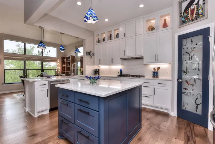 Kitchen featuring a large pantry with a custom door
