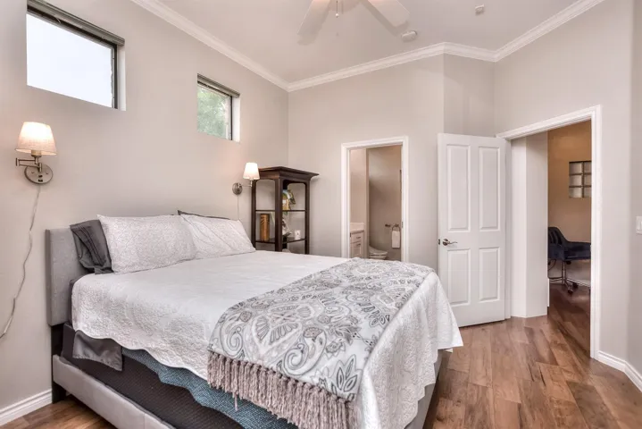 Bedroom featuring baseboards, ornamental molding,