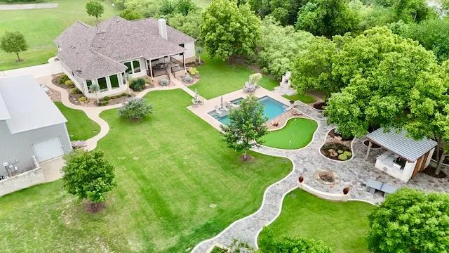 View of subject property with a pool