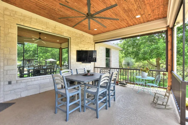 View of patio with a ceiling fan and outdoor dining space