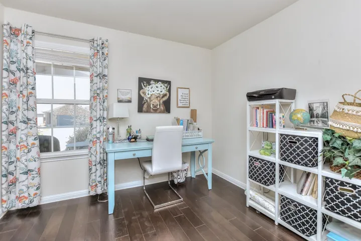 Office featuring baseboards and wood finished floors