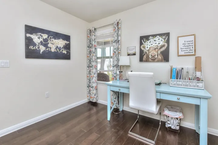 Office area with wood finished floors and baseboards