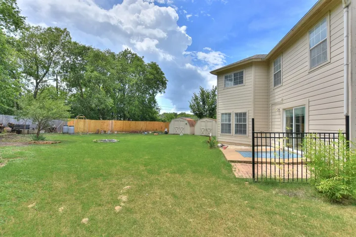 Exterior back of home...just look at the size of that yard! No neighbors behind!