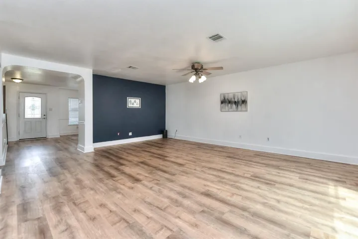 In this picture you see the front door entry and have walked past the front flexible dining space into an enormous open family room!