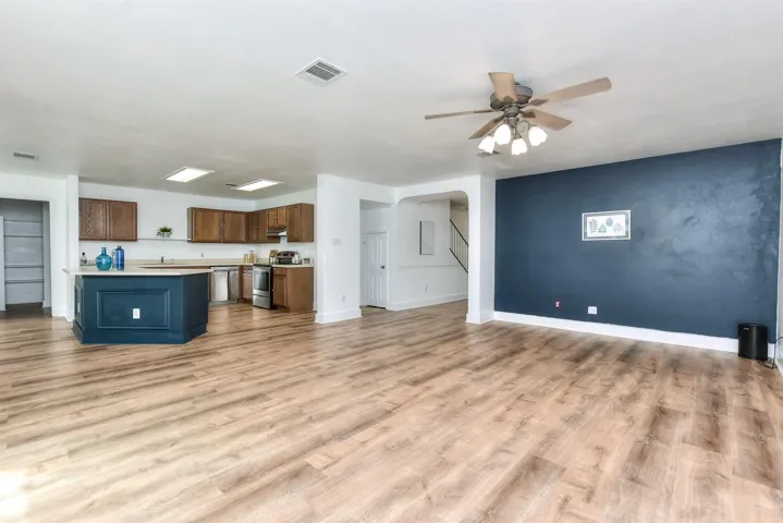 This shows how wide open this floor plan is....with luxury vinyl planking throughout all the first floor living spaces! 