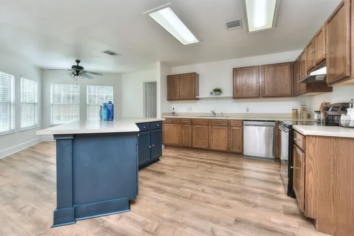 Abundant cabinets and countertop space add to the functionality of this kitchen!