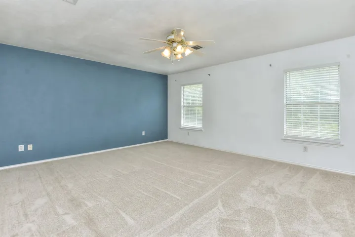 Enormous primary bedroom boasts and additional sitting/office space....literally a sanctuary!  
