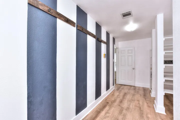 Add some storage benches here to create a perfect drop zone/mud room!