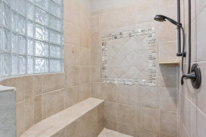Bathroom with a tile shower