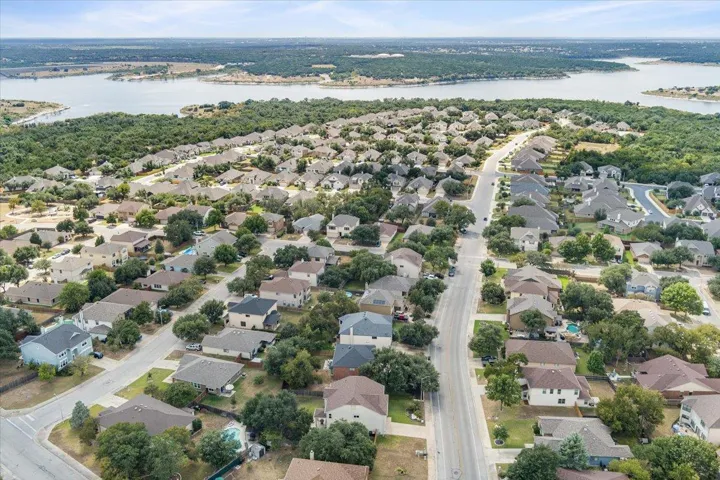 Aerial perspective of suburban close to hike and bike trail and lake
