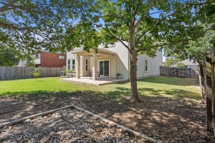 Rear view of house featuring a patio