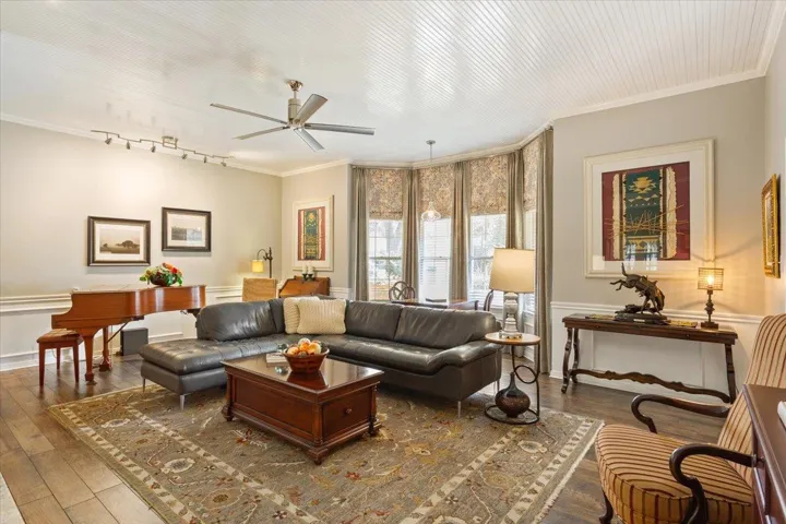 The gorgeous bead board ceiling in the family room & dining room really add a lot of personality to these rooms.  Custom draperies are a recent addtion... 