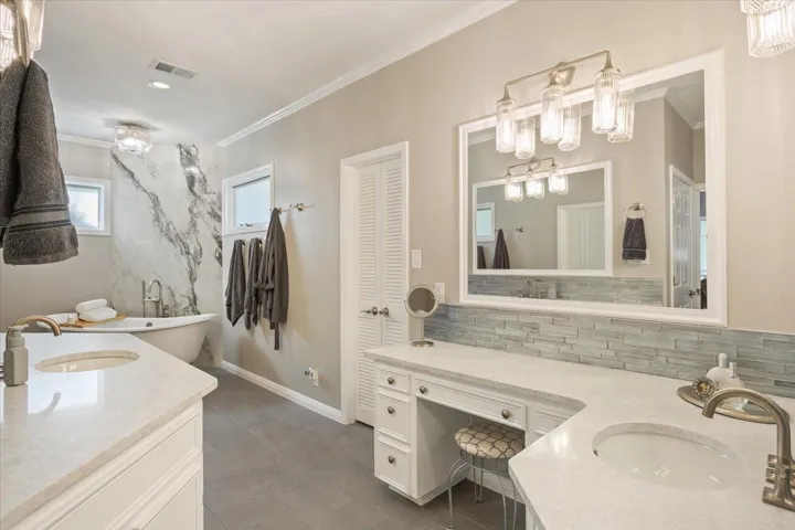 The primary bathroom also includes TWO walk-in closets