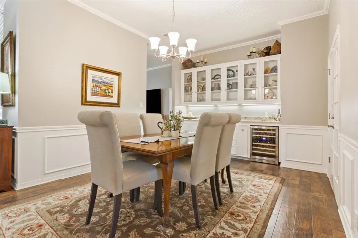 Crown molding & chair molding enhance the charm of this room.  A built in wine cabinet is featured in the built in cabinetry.  PLUS, there are 2 walk-in closets for storing seasonal serving dishes and/or decorations....SO accommodating!