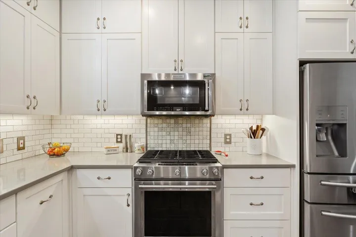 The five burner gas stove is a quality Kitchen-Aid stove...