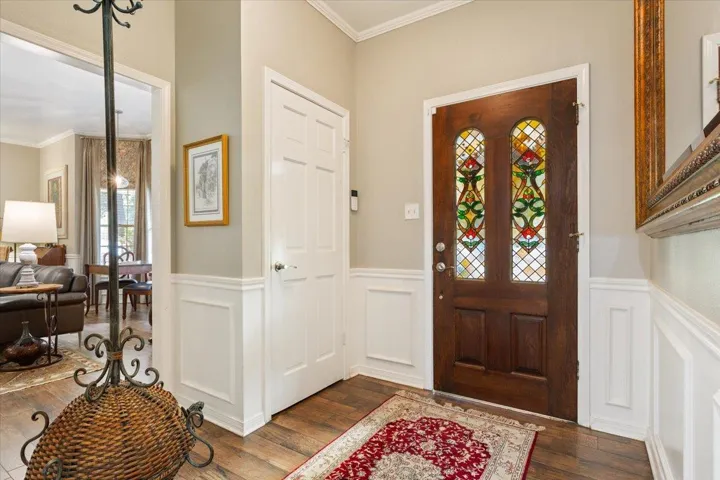 Welcome your guests here, hang their coat in the coat closet, and hang their hat.  Come on in!