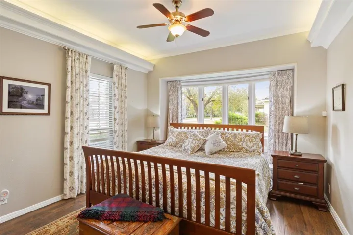 The window coverings at the headboard of the bed have window coverings that are controlled by a remote control...