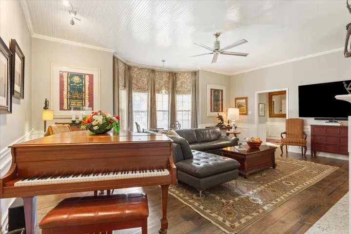 As you enter the foyer, to the right is the great room.  Seriously inviting & warm with a bay window,...
