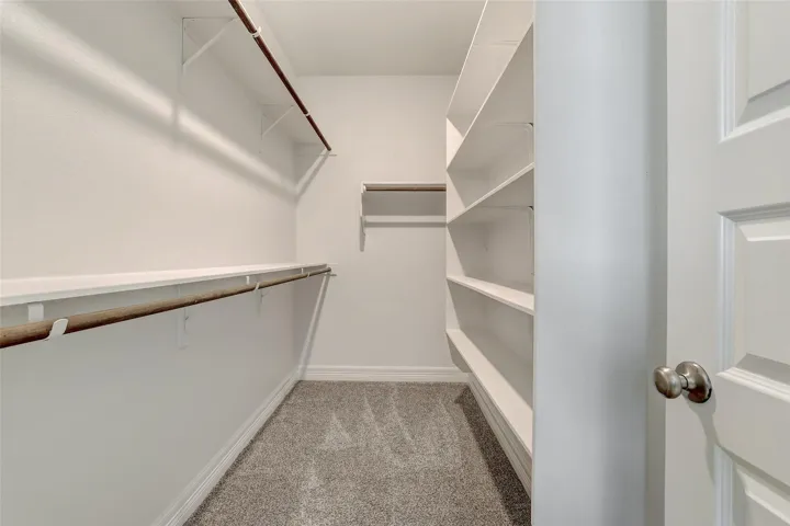 Large Walk in Closet with built in shelving