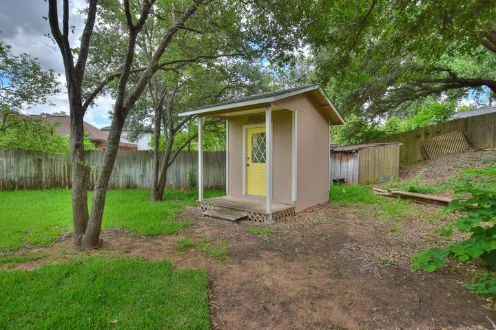 View of shed featuring a fenced backyard