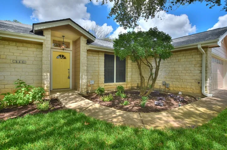 View of exterior entry with stone siding