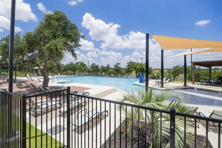 Community pool with a patio area