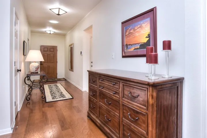 This buffet is conveniently located across from the open entry to the formal dining room...