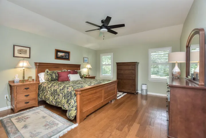 Just to the left is the entry to the Primary Suite.  Every room facing the backyard has a view of nature...